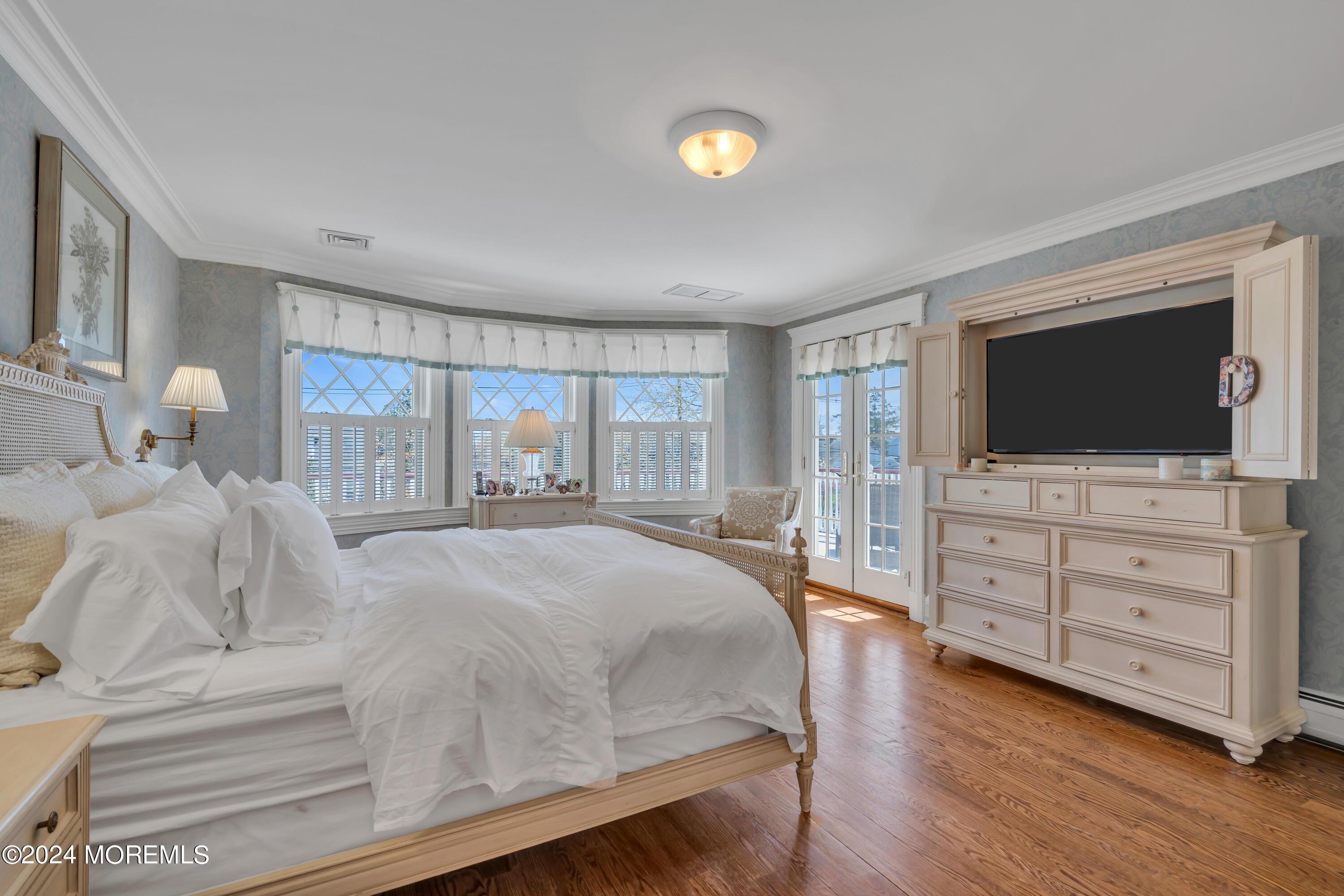 801 5th Avenue Spring Lake, NJ 07762 - Photo 40 of 97 a large bedroom with a bed and flat screen tv