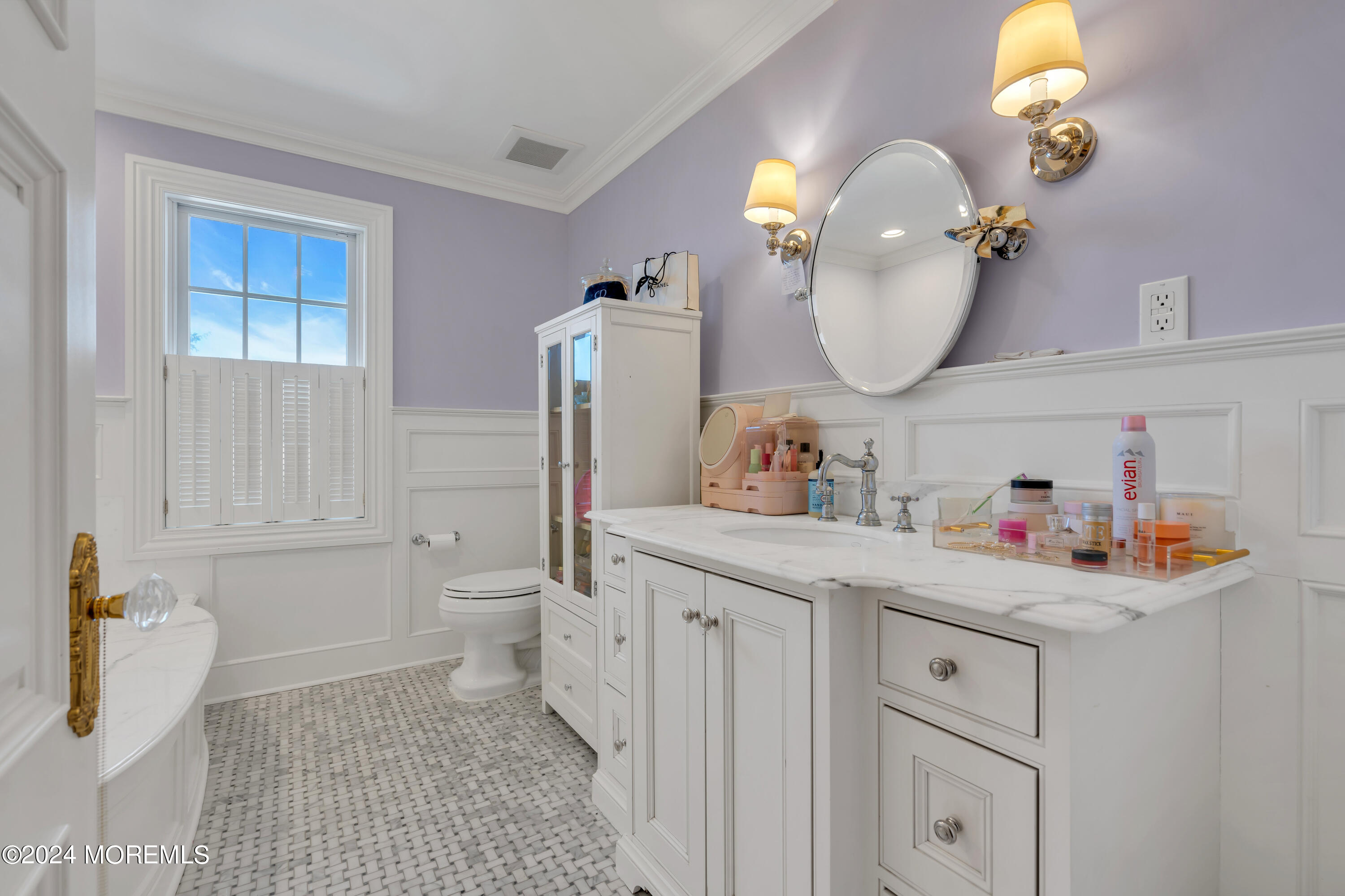 801 5th Avenue Spring Lake, NJ 07762 - Photo 50 of 97 a bathroom with a sink a toilet and a mirror