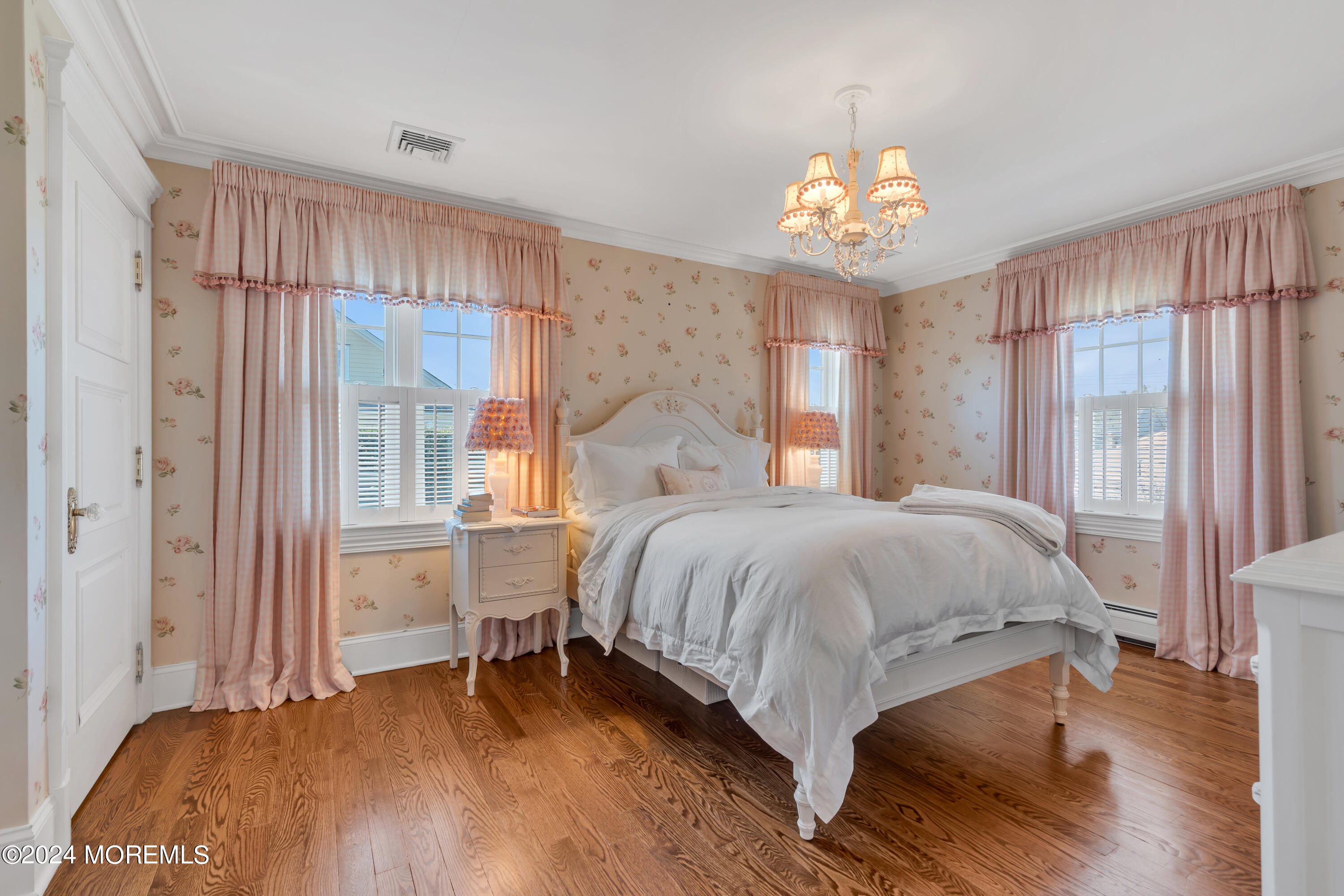 801 5th Avenue Spring Lake, NJ 07762 - Photo 52 of 97 a bedroom with a bed and a chandelier