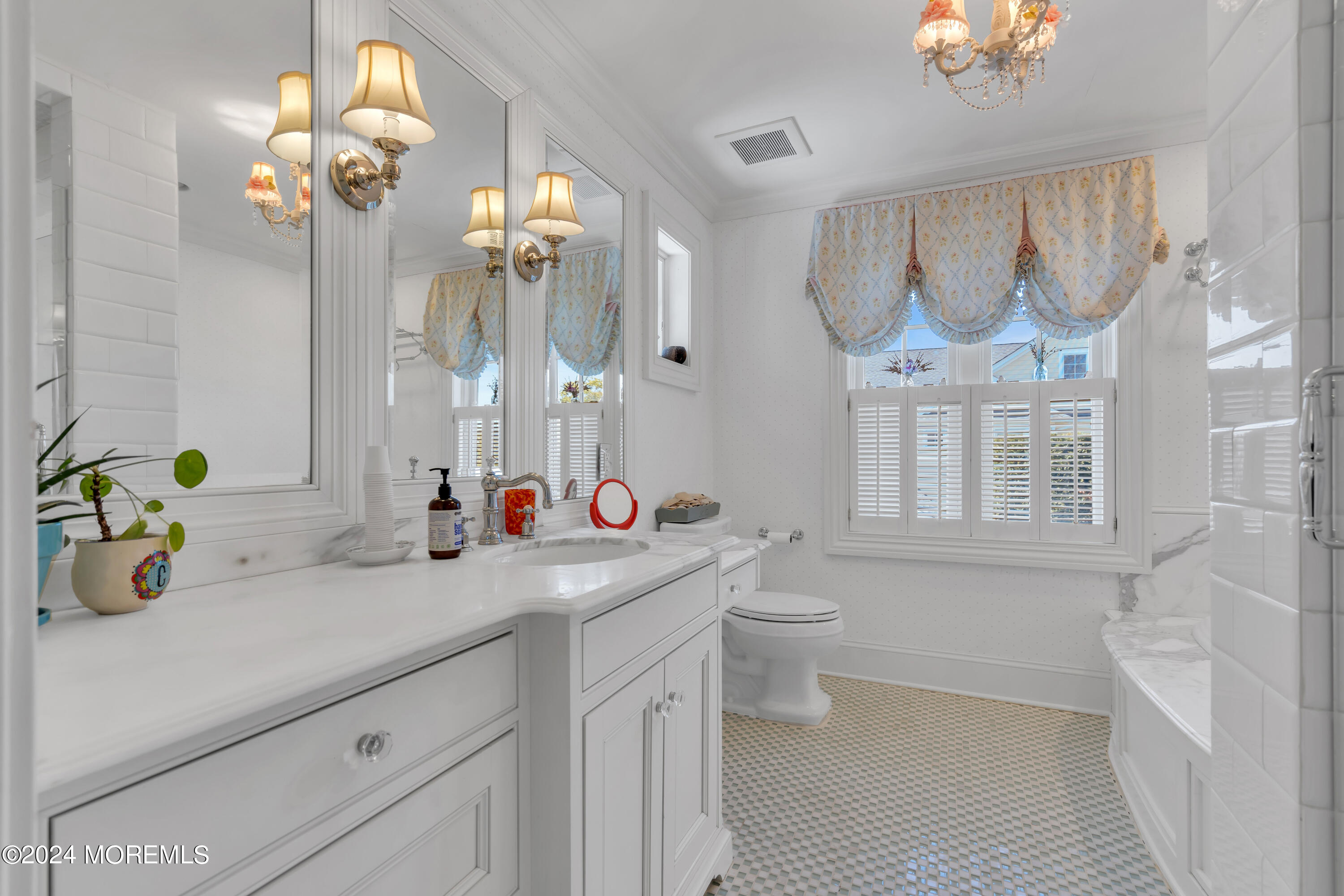 801 5th Avenue Spring Lake, NJ 07762 - Photo 53 of 97 a bathroom with a sink a toilet and a mirror