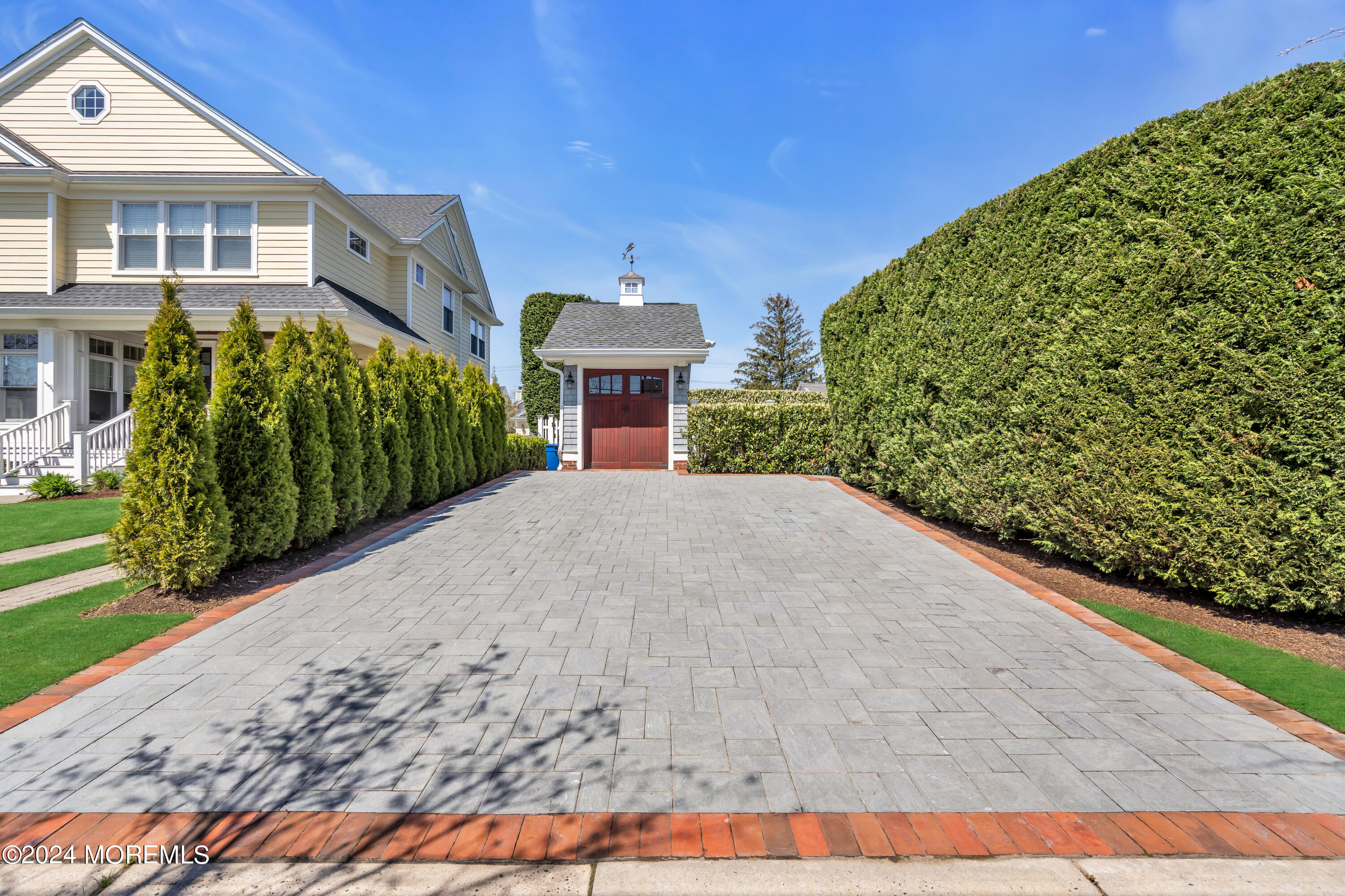 801 5th Avenue Spring Lake, NJ 07762 - Photo 87 of 97 a view of a house with a small yard and potted plants