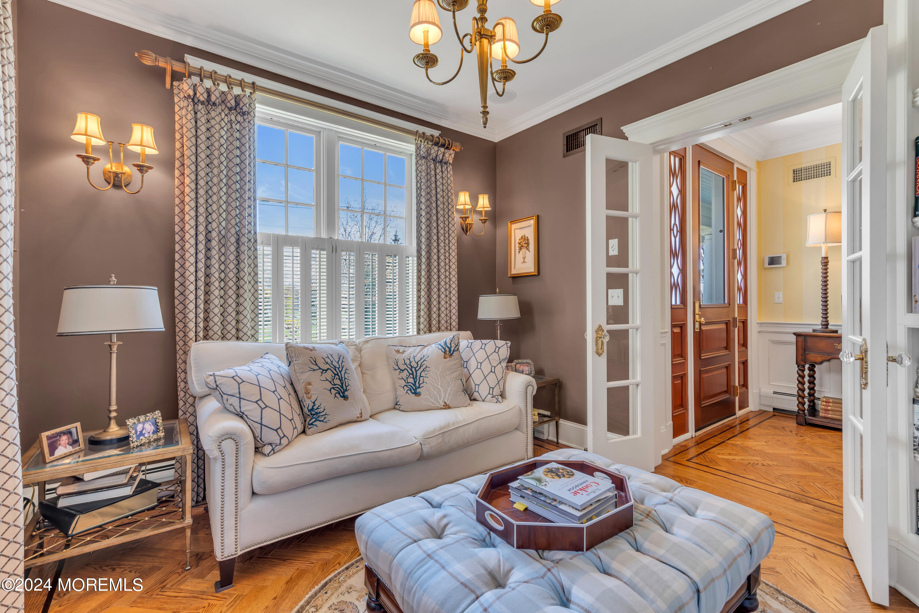 801 5th Avenue Spring Lake, NJ 07762 - Photo 9 of 97 a living room with furniture and a chandelier