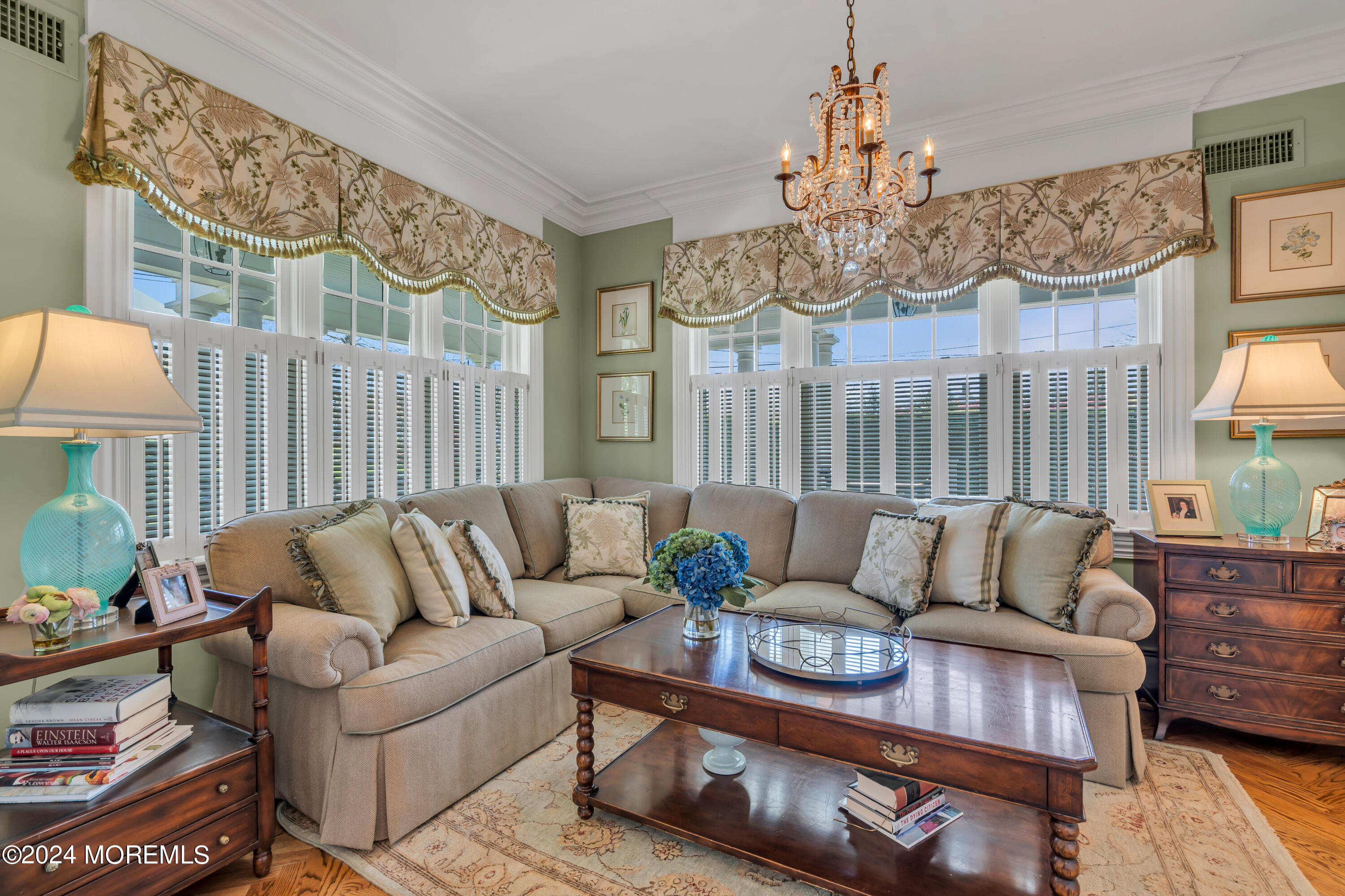 801 5th Avenue Spring Lake, NJ 07762 - Photo 10 of 97 a living room with furniture and a chandelier