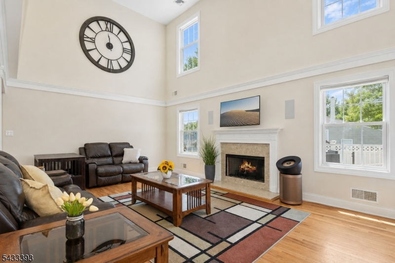 33 Stanton Street Clark, NJ 07066 - Photo 4 of 37 a living room with furniture a fireplace and a window