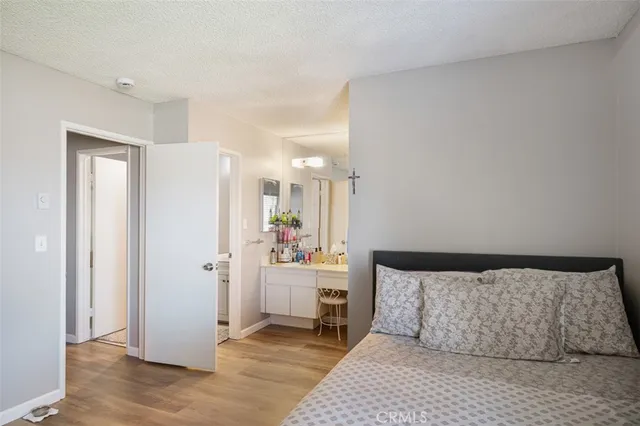 a bedroom with a bed and a table