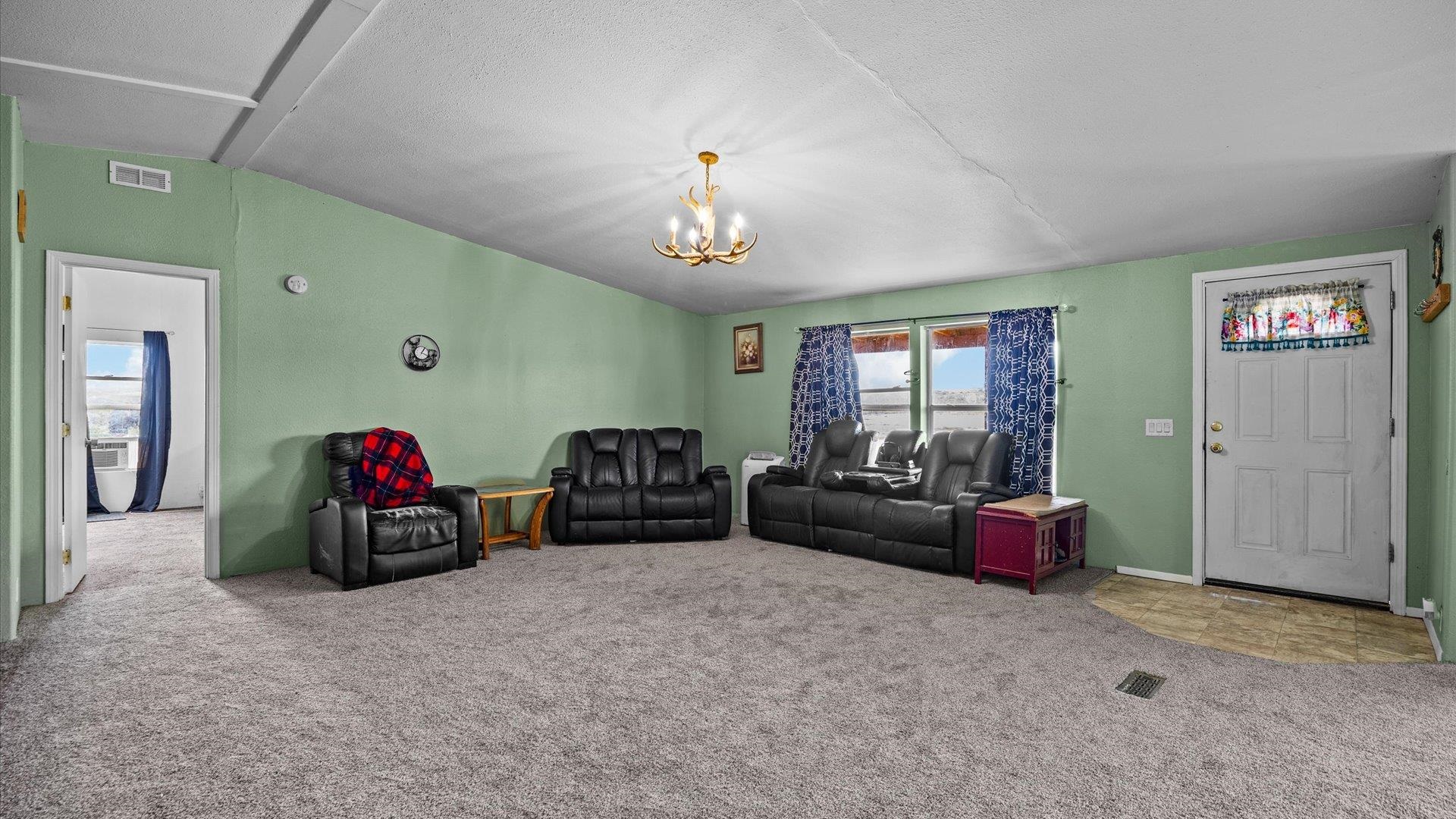 110 Blair Road Whitewater, CO 81527 - Photo 8 of 32 a living room with furniture and a flat screen tv