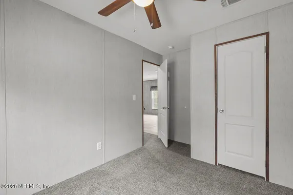 an empty room with a bathroom