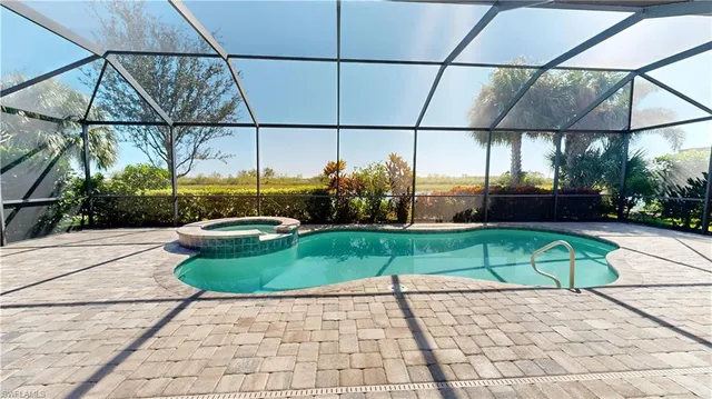 a view of a swimming pool with a patio