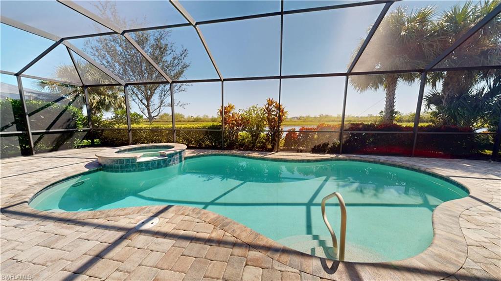 6354 Achievement Avenue Ave Maria, FL 34142 - Photo 27 of 50 a view of a backyard with sitting area