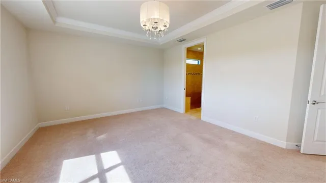 a view of empty room with a fireplace