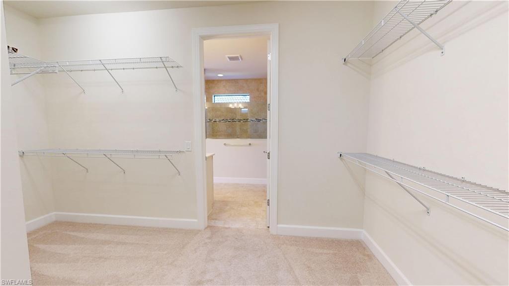 6354 Achievement Avenue Ave Maria, FL 34142 - Photo 35 of 50 a view of walk in closet with empty racks