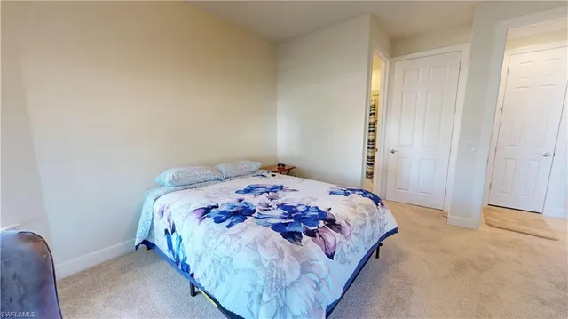 a bathroom with a toilet and a shower curtain