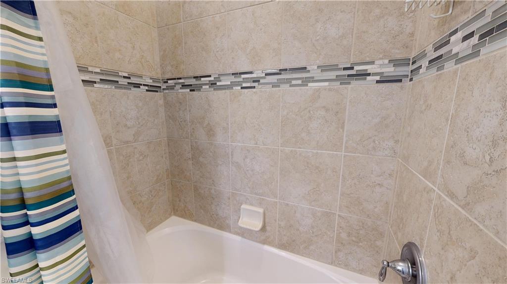6354 Achievement Avenue Ave Maria, FL 34142 - Photo 39 of 50 a bathroom with a shower and a bathtub