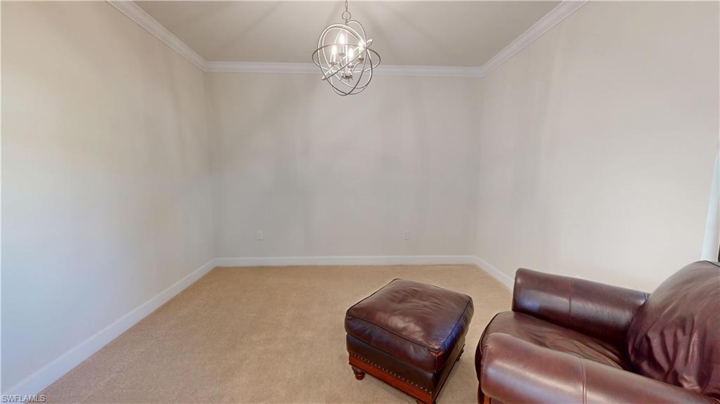 6354 Achievement Avenue Ave Maria, FL 34142 - Photo 40 of 50 a living room with furniture and a wall painting