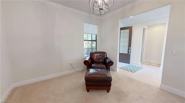 a view of kitchen with furniture and refrigerator
