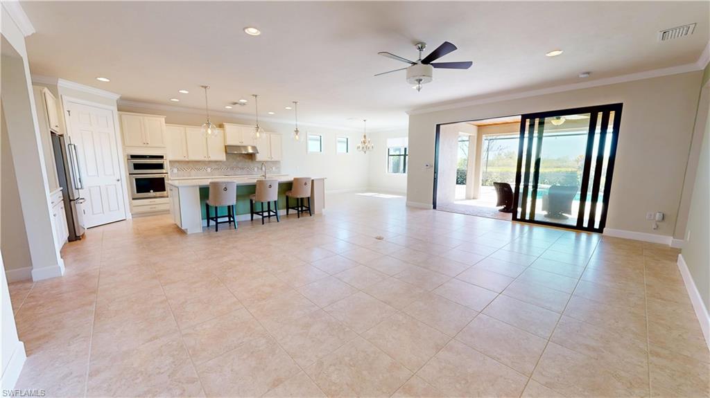 6354 Achievement Avenue Ave Maria, FL 34142 - Photo 42 of 50 a view of kitchen with furniture and refrigerator