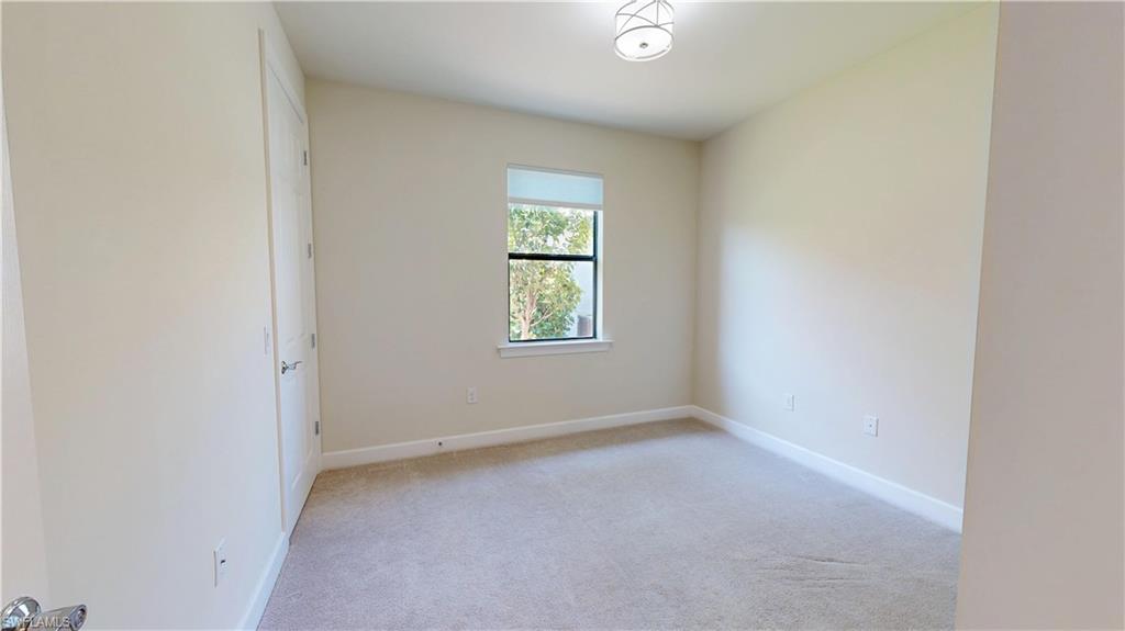 6354 Achievement Avenue Ave Maria, FL 34142 - Photo 43 of 50 an empty room with windows
