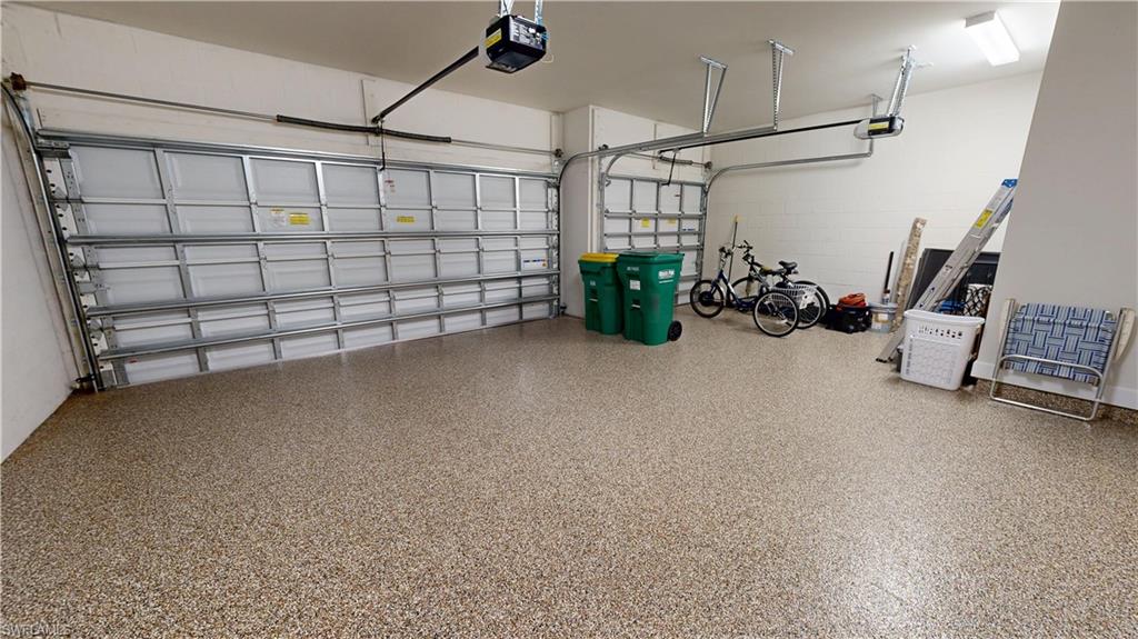 6354 Achievement Avenue Ave Maria, FL 34142 - Photo 48 of 50 a view of a garage with storage and racks on the wall