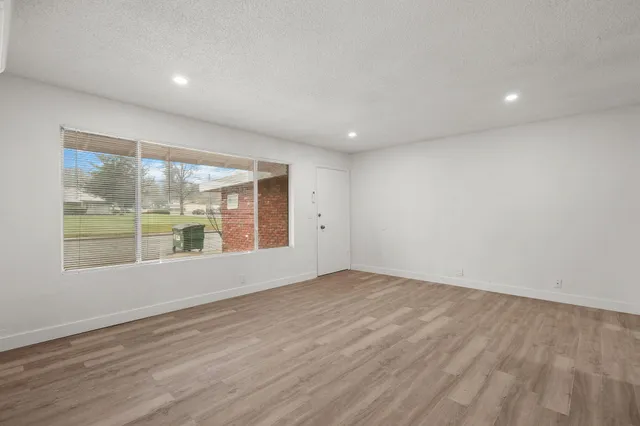 a kitchen with cabinets stainless steel appliances and sink