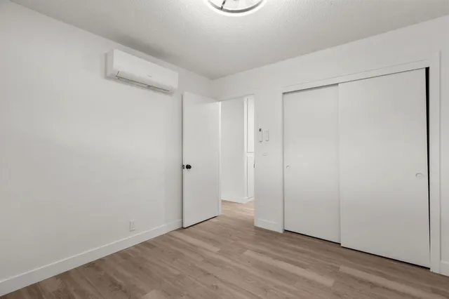 a bathroom with a sink vanity mirror and toilet
