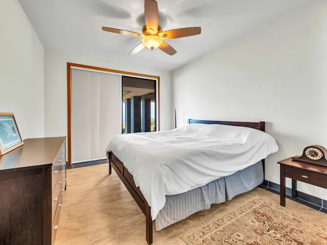 a large kitchen with stainless steel appliances granite countertop a lot of counter space and wooden floor