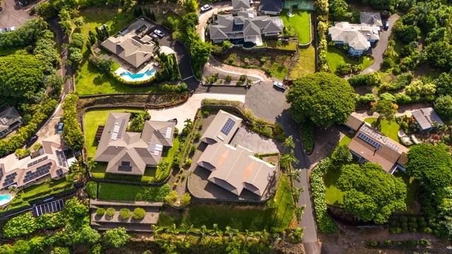 an aerial view of residential house with outdoor space and swimming pool
