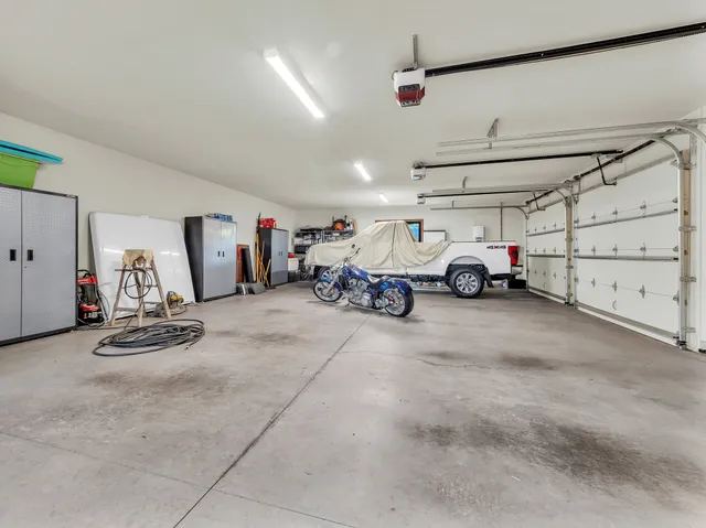 a view of parking garage with cars