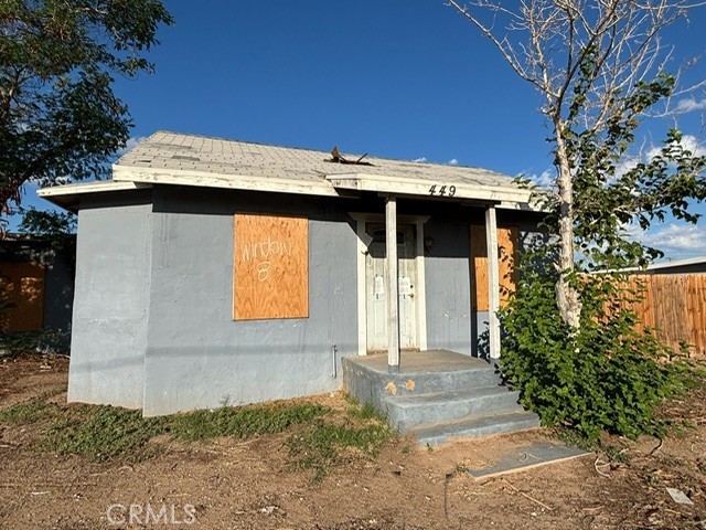 449 North 7th Street Blythe, CA 92225 - Photo 2 of 9 a front view of a house with garden