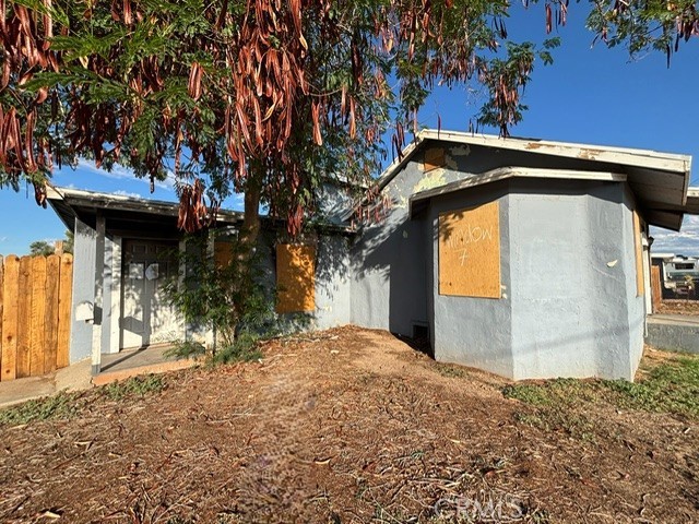 449 North 7th Street Blythe, CA 92225 - Photo 3 of 9 a view of a house with a tree