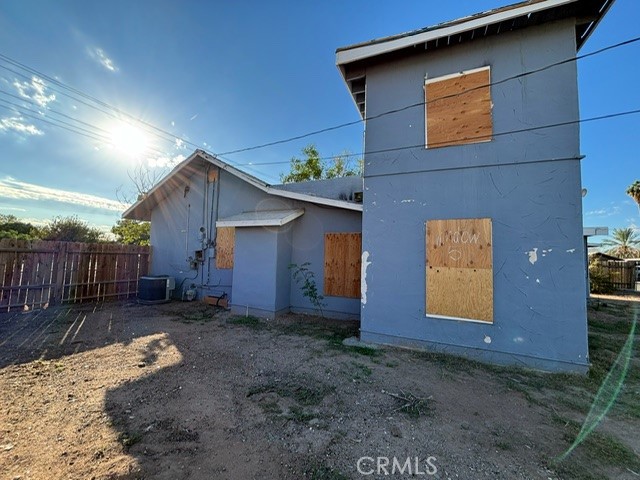 449 North 7th Street Blythe, CA 92225 - Photo 7 of 9 a backyard of a house with yard and outdoor seating