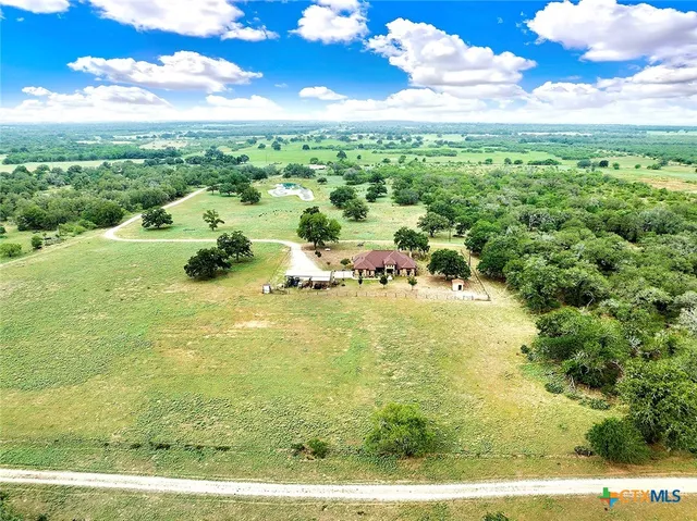 a kitchen with stainless steel appliances a stove refrigerator sink and microwave