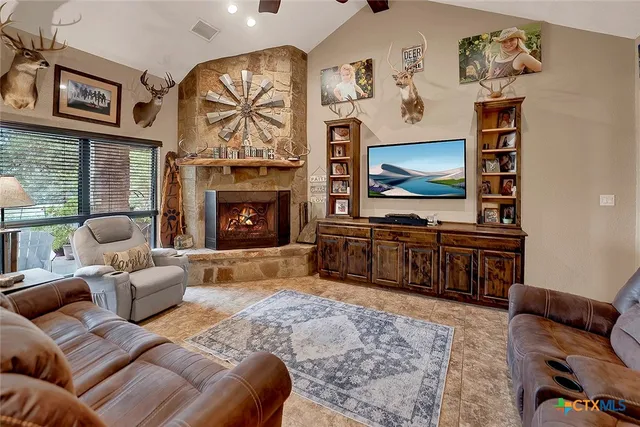 a kitchen with stainless steel appliances a refrigerator and a stove top oven
