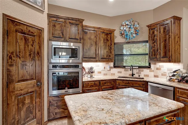 a bedroom with bed and a chandelier