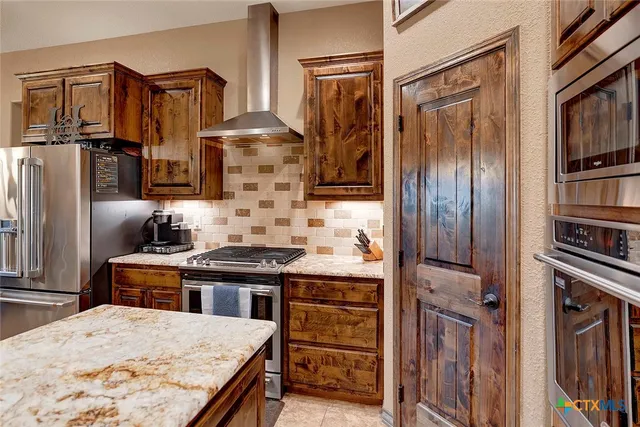 a bedroom with a bed wooden floor and window