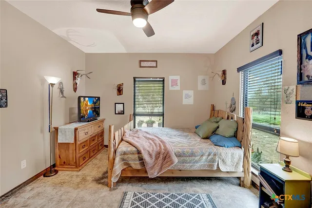 a backyard of a house with a yard and outdoor seating