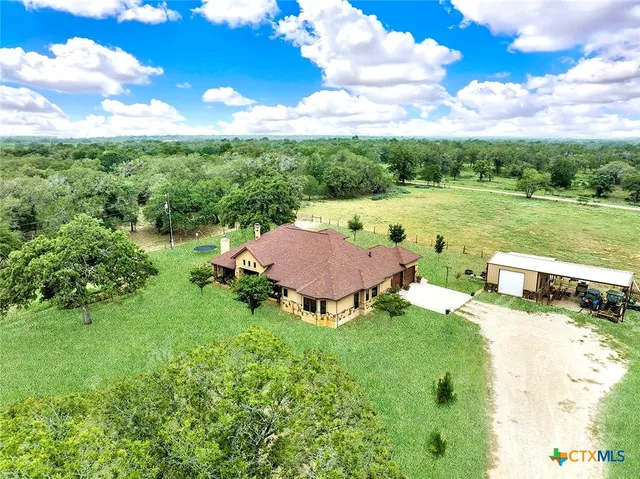 a kitchen with sink stove and cabinets