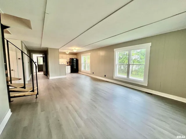a view of a livingroom with wooden floor