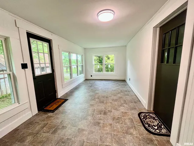 an empty room with windows