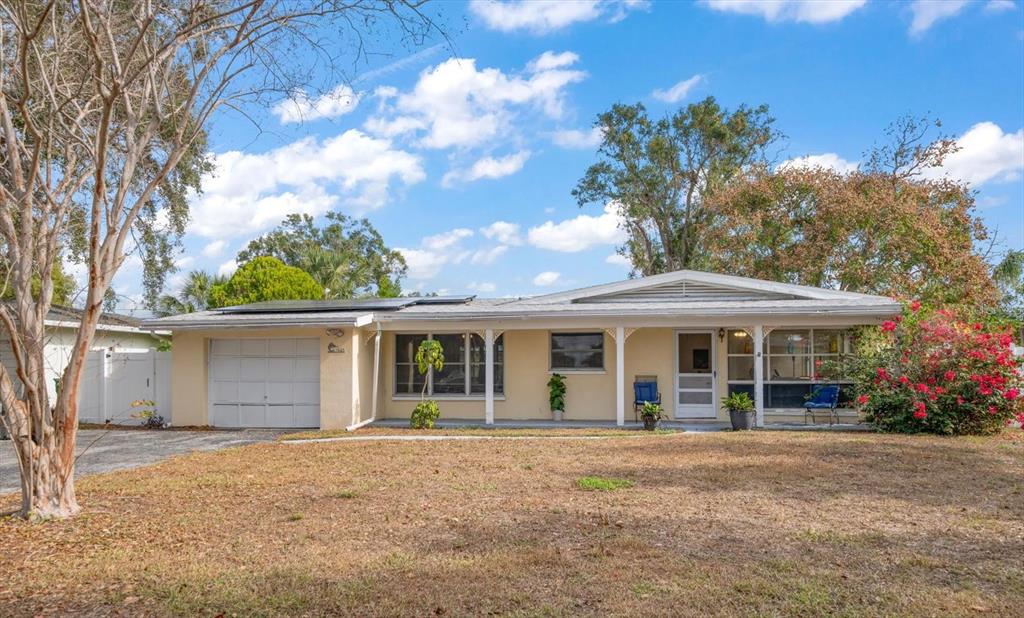 front view of a house with a garden