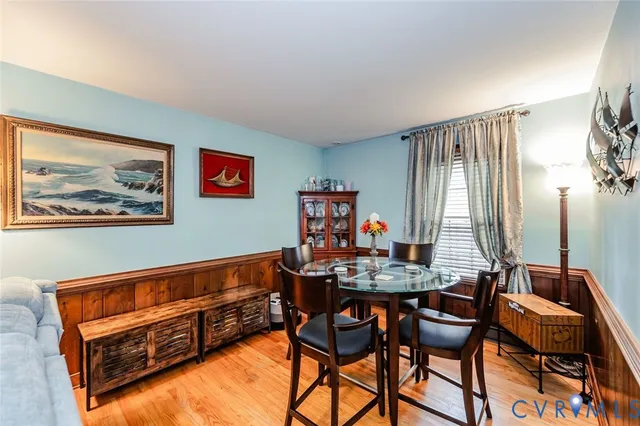 a view of a workspace with furniture and window