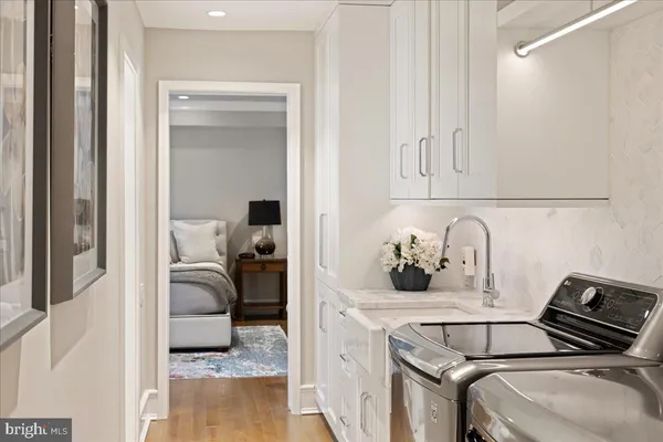 a bathroom with a granite countertop sink and shower