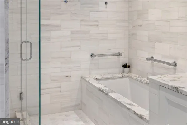 a bathroom with a sink vanity and a mirror