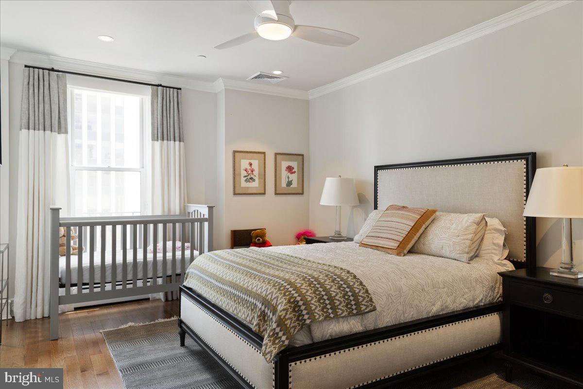 1901 Walnut Street, Unit 19D & 20D Philadelphia, PA 19103 - Photo 26 of 35 a bedroom with a bed and a tv