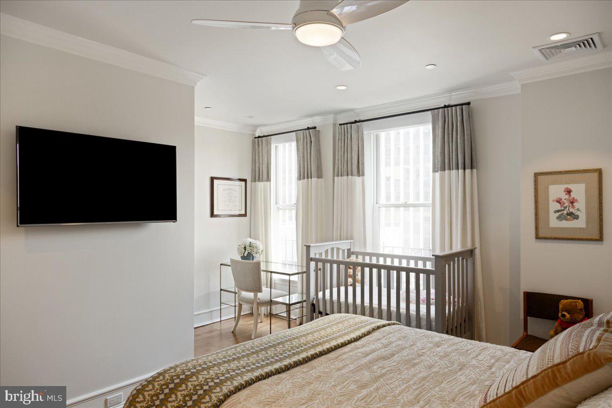 1901 Walnut Street, Unit 19D & 20D Philadelphia, PA 19103 - Photo 27 of 35 a bedroom with a bed and a flat screen tv