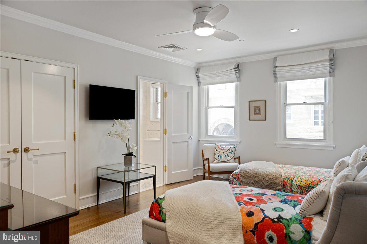 1901 Walnut Street, Unit 19D & 20D Philadelphia, PA 19103 - Photo 29 of 35 a bedroom with furniture and a flat screen tv