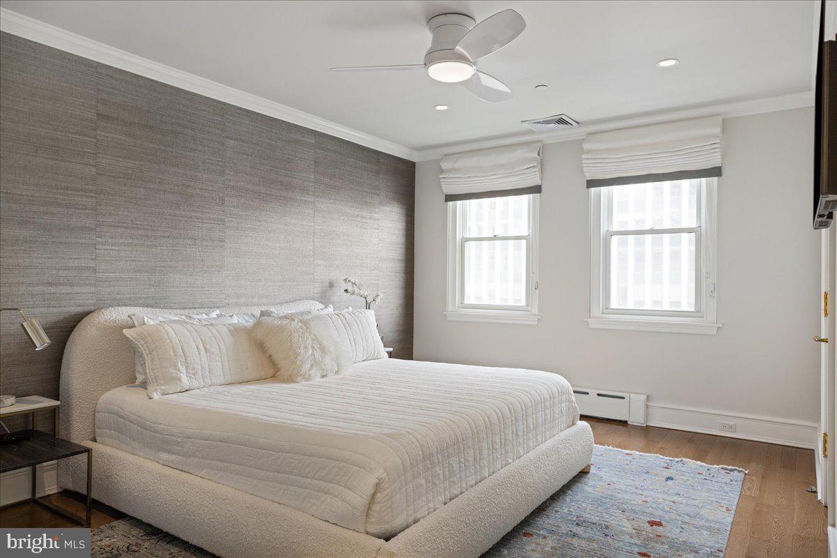 1901 Walnut Street, Unit 19D & 20D Philadelphia, PA 19103 - Photo 31 of 35 a bedroom with a bed and a window