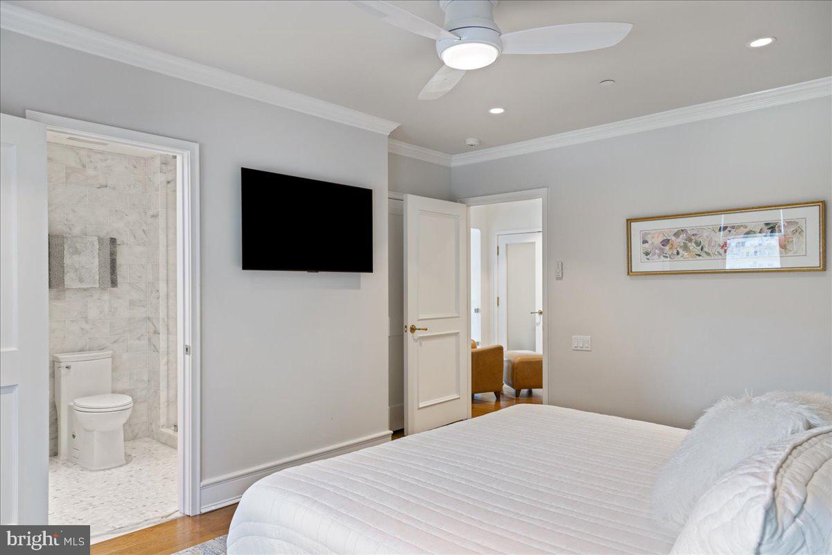 1901 Walnut Street, Unit 19D & 20D Philadelphia, PA 19103 - Photo 32 of 35 a bedroom with a bed and a flat screen tv