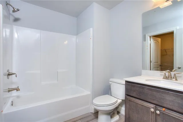 a bathroom with a sink a toilet and a bathtub