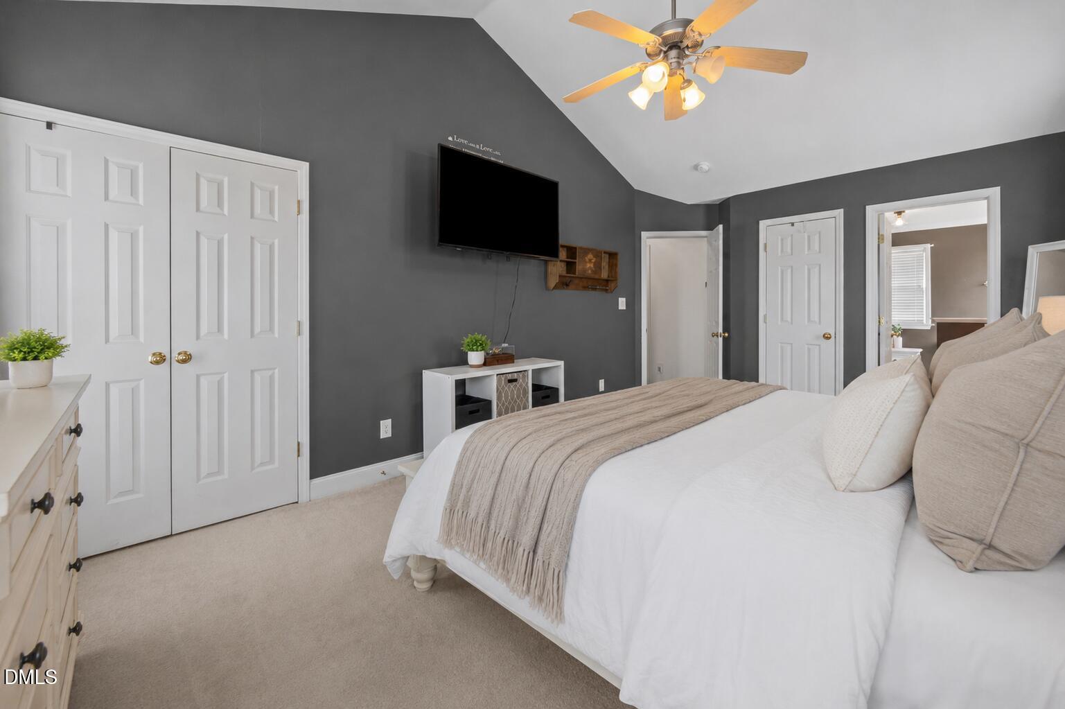 51 Water Front Lane Timberlake, NC 27583 - Photo 17 of 29 a bedroom with a bed and a flat screen tv