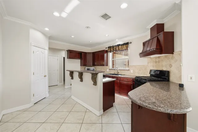 a view of a chandelier in big room and windows